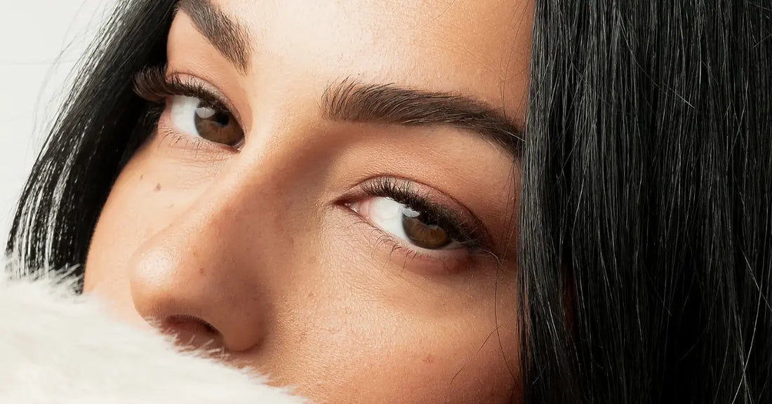 At-home lash extensions shown in a close-up of fluttery, defined lashes with natural eye makeup.