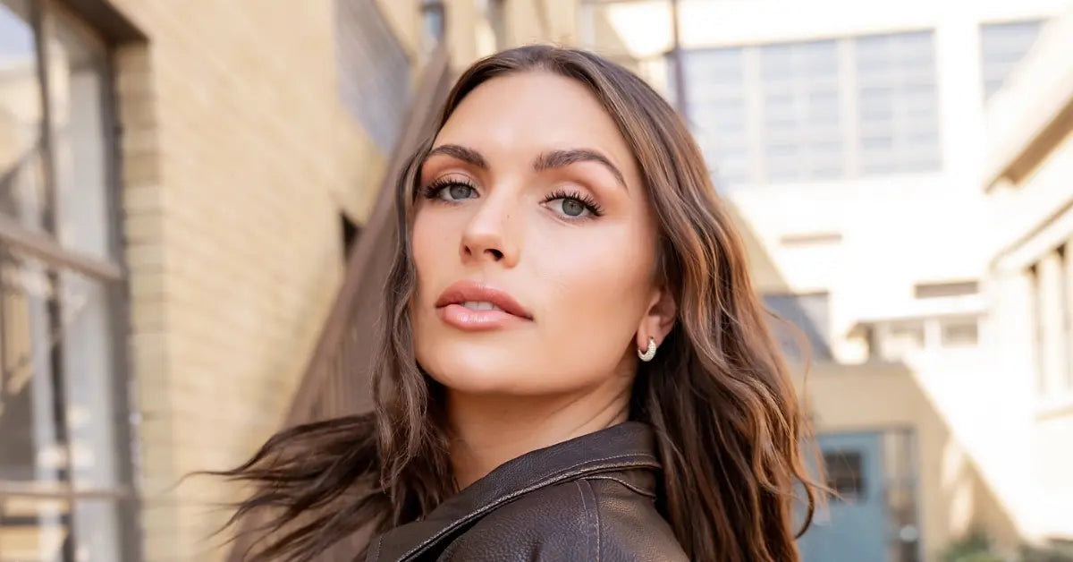 Lash extension at-home kit shown on a woman outdoors with fluttery lashes and a leather jacket