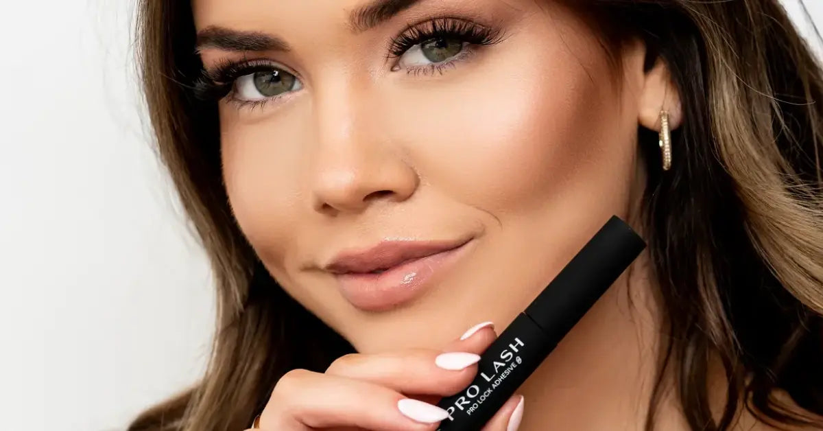 Lash glue Pro Lash Pro Lock Adhesive held by a woman wearing flawless lash extensions