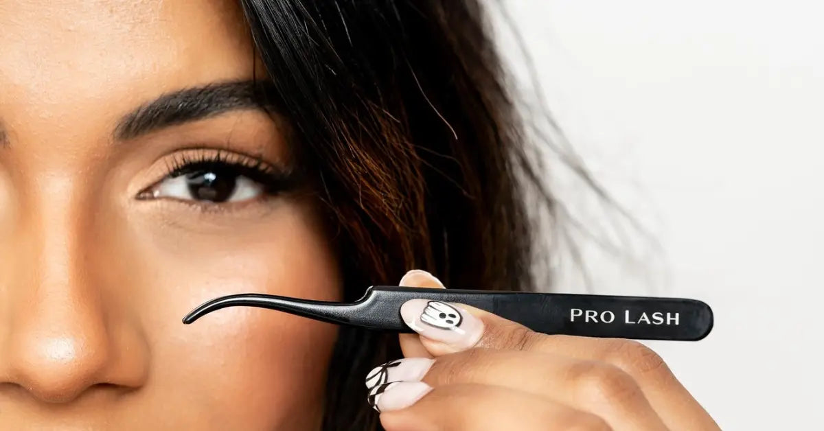 Mega lash extensions showcased on woman holding Pro Lash tweezers near dramatic, voluminous lashes