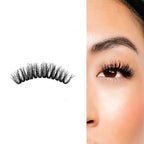 Feathered eyelash extensions shown off-eye and applied, featuring soft, fluttery volume with tapered ends for a natural glam look