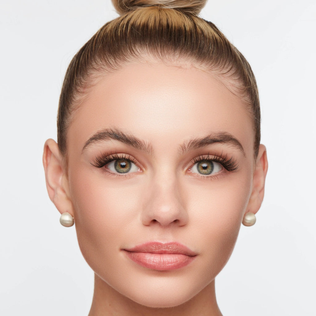 Classic wispy lashes styled on a woman with a polished look, featuring defined volume and soft, natural length