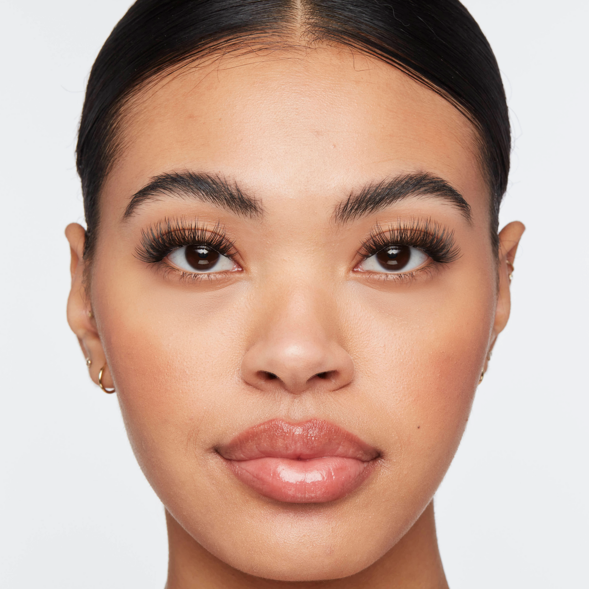 Volume lash extensions on woman with bold, full lashes that enhance eye shape and create a glamorous look.