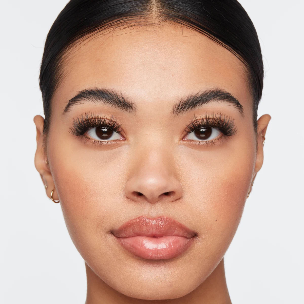 Volume lash extensions on woman with bold, full lashes that enhance eye shape and create a glamorous look.