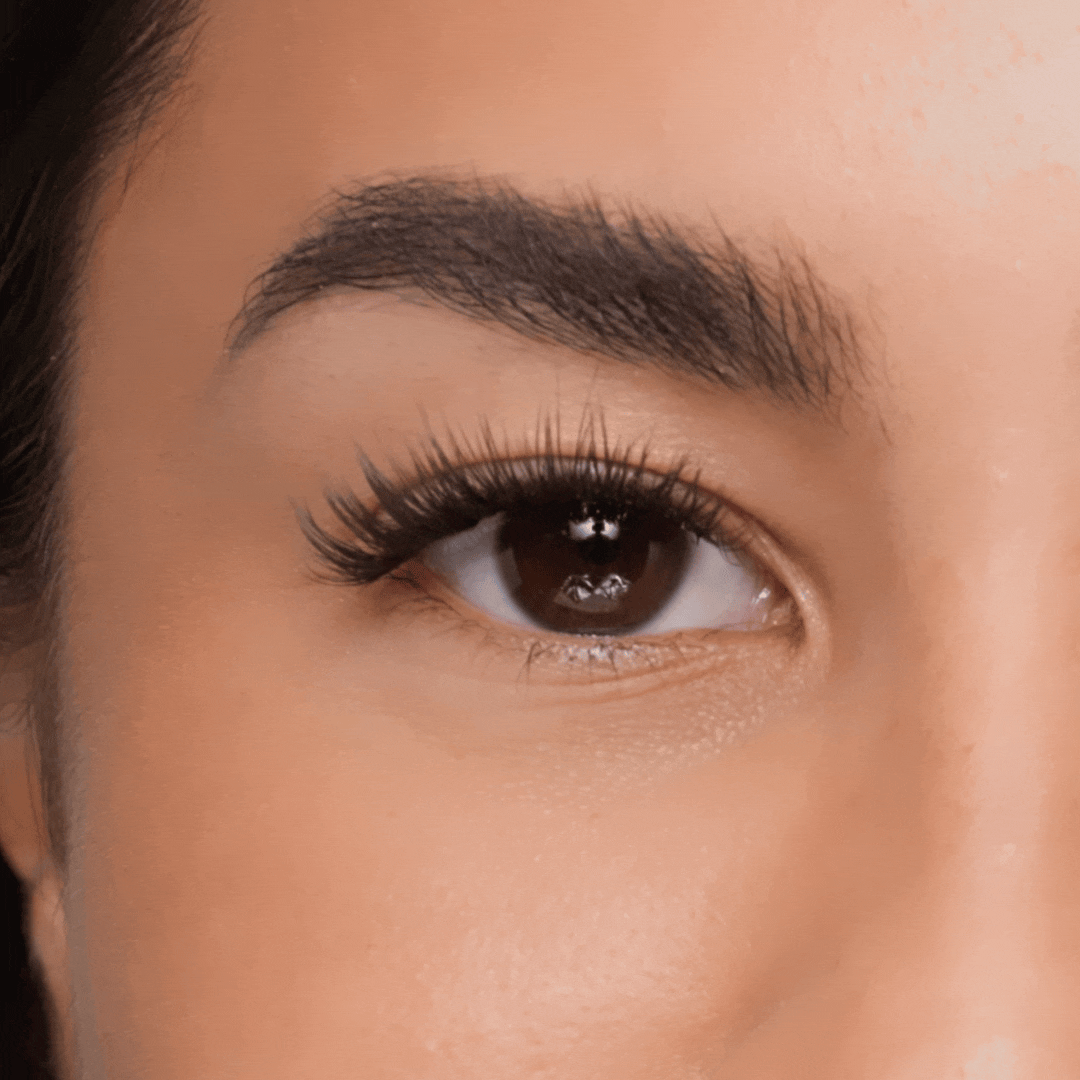 Volume eyelash extension applied on eye, creating a full, defined lash line with soft, wispy texture.