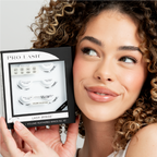 Woman holding a box of Pro Lash Volume Feathered Wings No. 42, smiling.