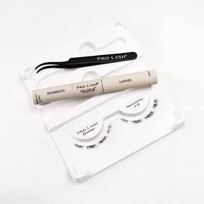 Eyelash extension kit with Pro Lash segments, adhesive, tweezers, and Natural Doll Eye No. 38 lashes.