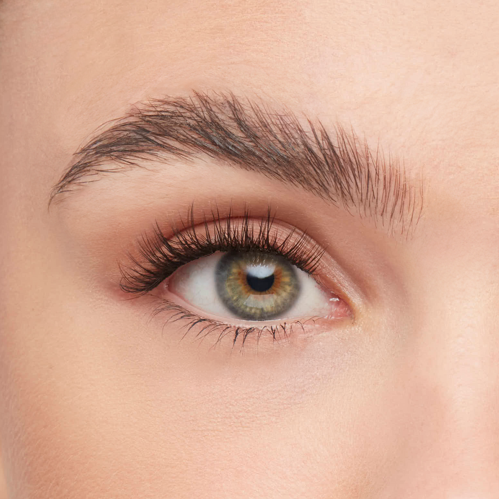 Volume eyelash extensions kit applied on eye, showcasing full, fluttery lashes with a natural yet enhanced appearance
