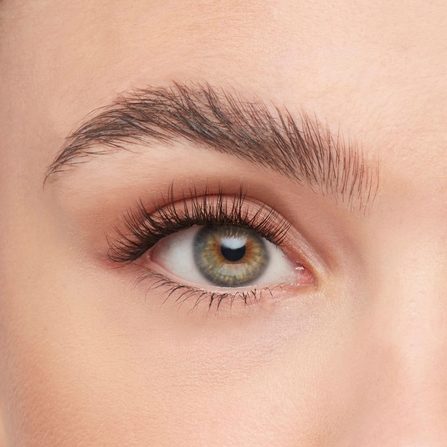 Volume eyelash extensions kit applied on eye, showcasing full, fluttery lashes with a natural yet enhanced appearance