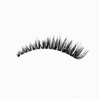 Wispy volume eyelash extensions with flared cat eye shape and layered texture for a lifted, dramatic effect.